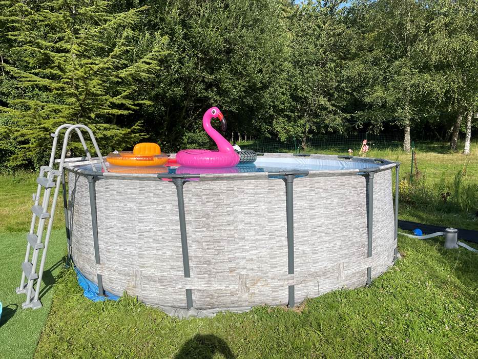 Swimming pool with safety ladder