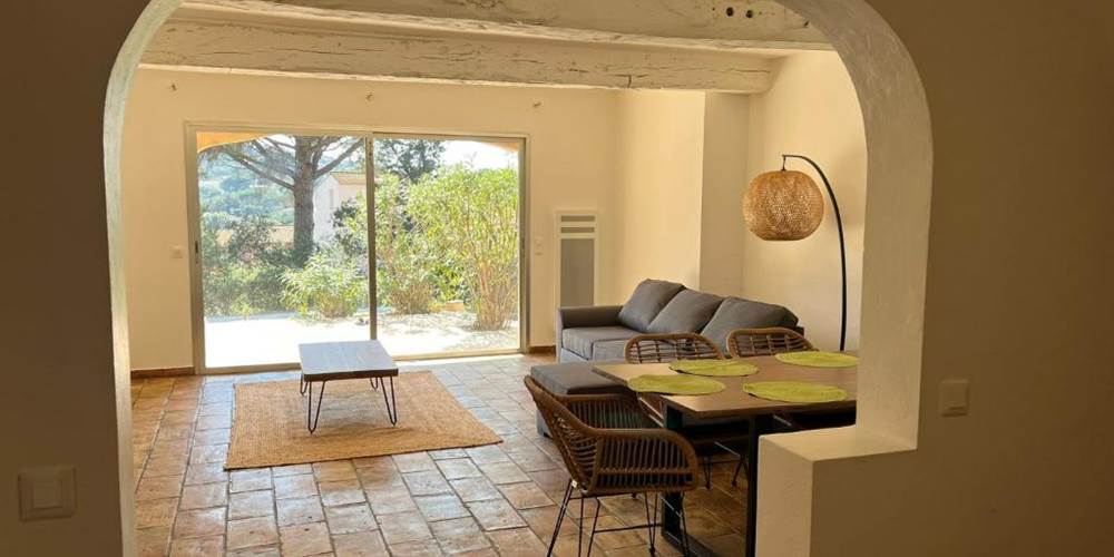 Bright living room with wide patio doors opening onto garden and pool, Villa Lou Pantaï