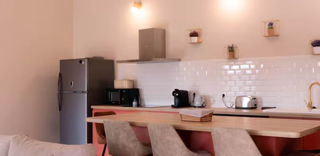 coin cuisine avec îlot Appartement La Bastide