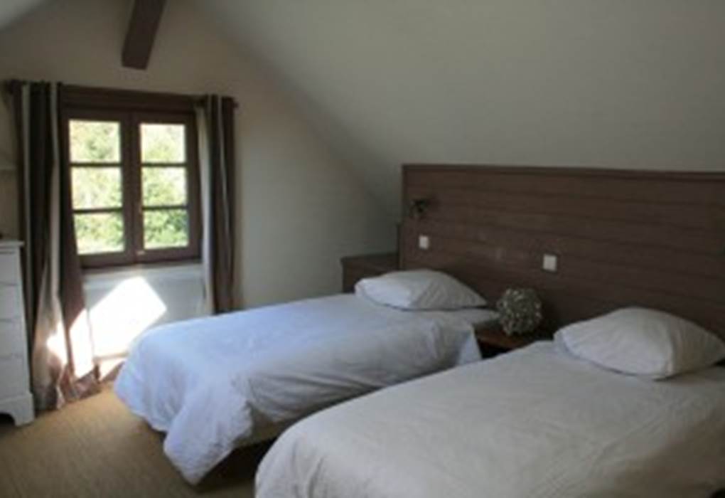 La chambre à l'étage avec ses lits jumeaux