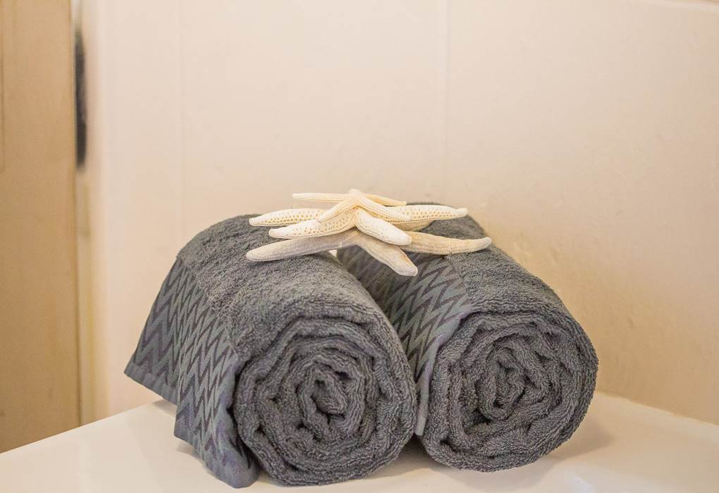 Draps, essuie de bains et plage fournis