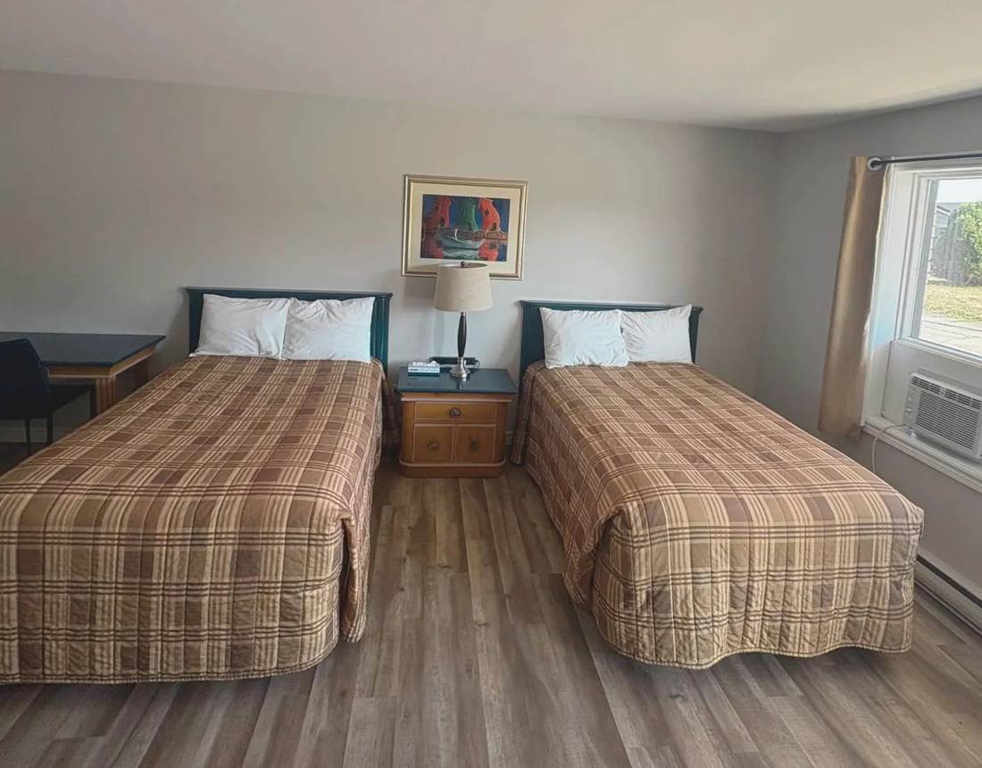 Chambre confortable avec 2 lits doubles