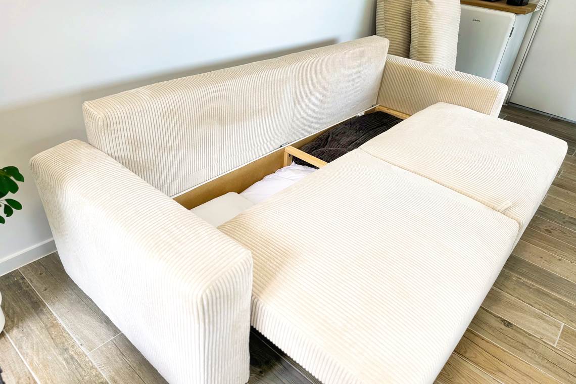 studio-le-lodge-canape-convertible-lit-rangement.jpg