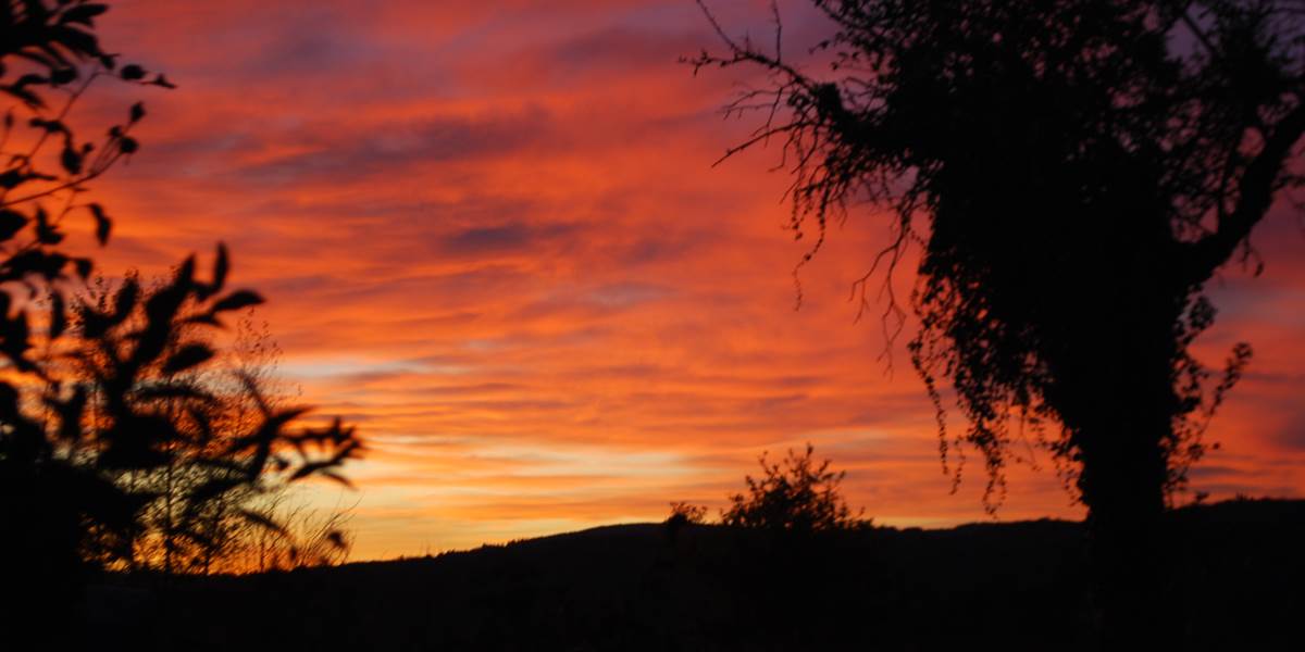 couché de soleil vu de la Salle de Restaurant au Ranch des Lacs 87120