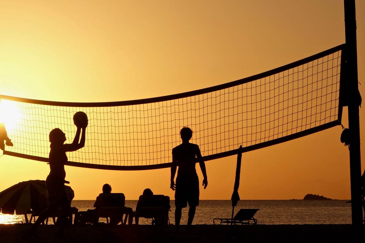 silhouette-photography-of-people-playing-beach-volleyball-2444852
