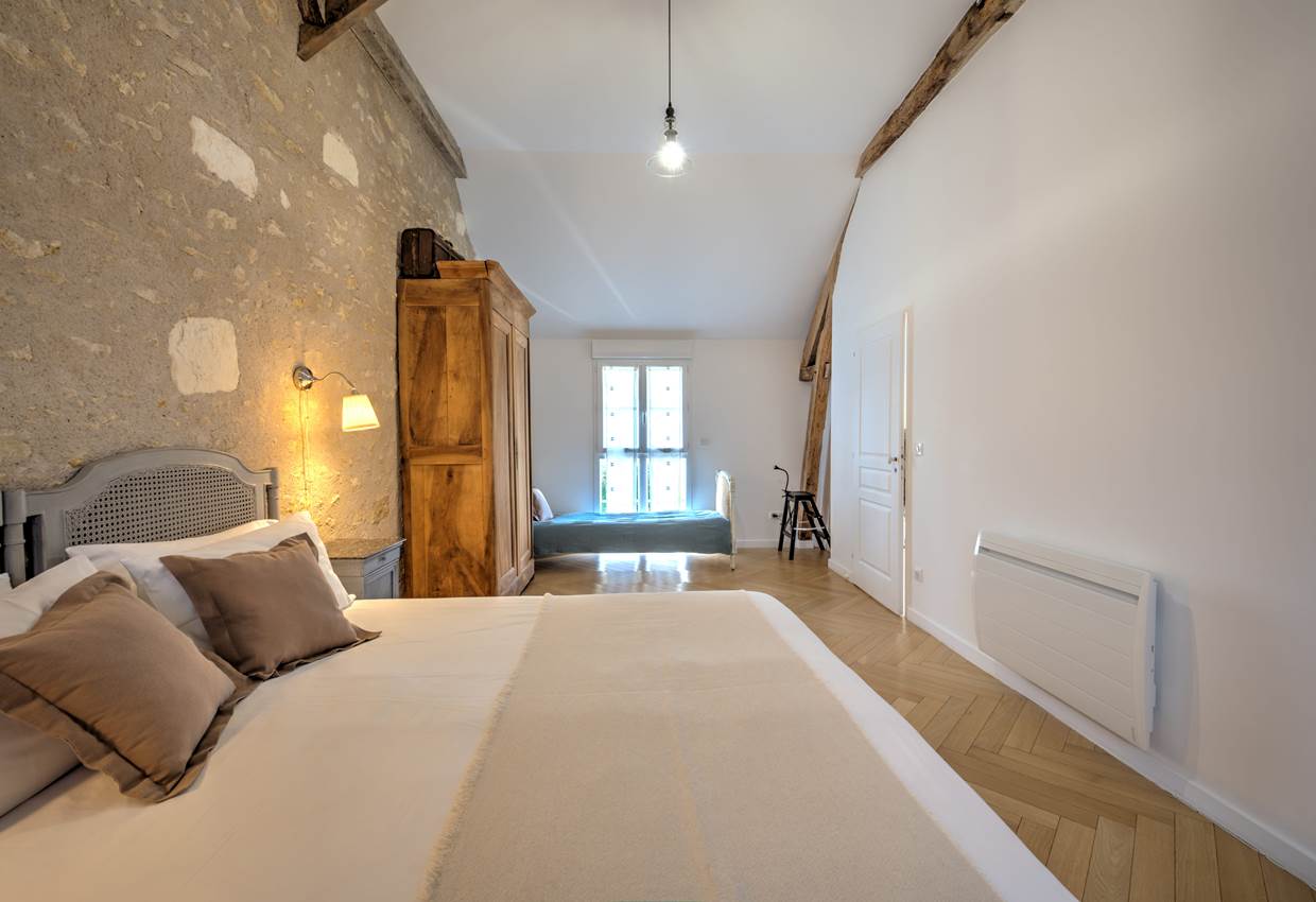La chambre Grise au choix en lit double...
