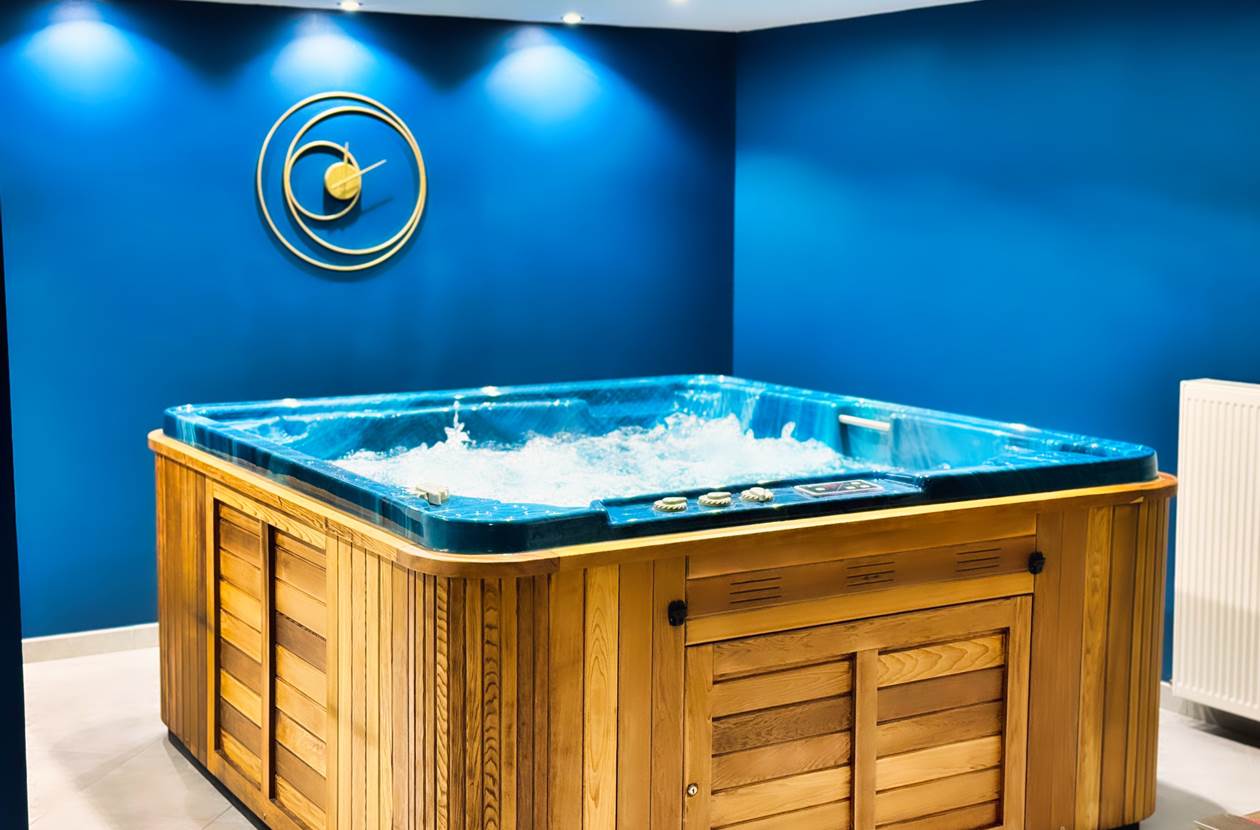 Jacuzzi privatif en bois dans spa intimiste – Spa Le Magnolia