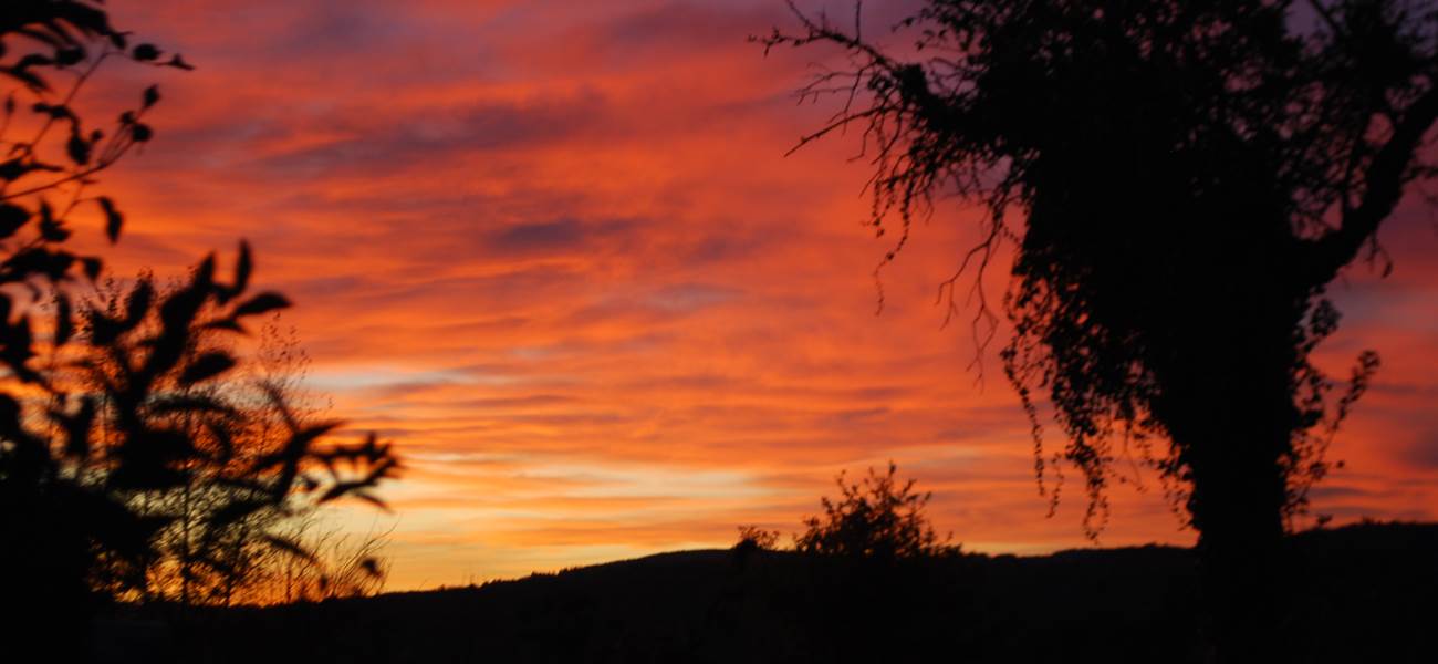 couché de soleil vu de la Salle de Restaurant au Ranch des Lacs 87120
