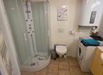 Douche version cabine quart de rond
