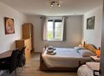 Grande chambre dans une maison de vacances