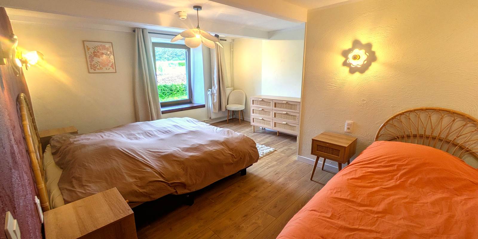 Bright family bedroom with king bed, single bed and modern en-suite shower