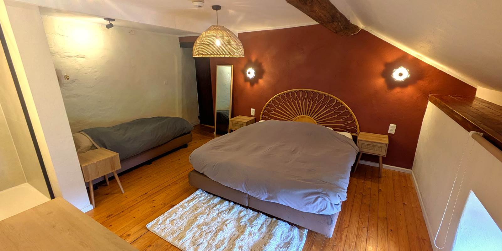 Family bedroom with king bed, single bed and private walk-in shower