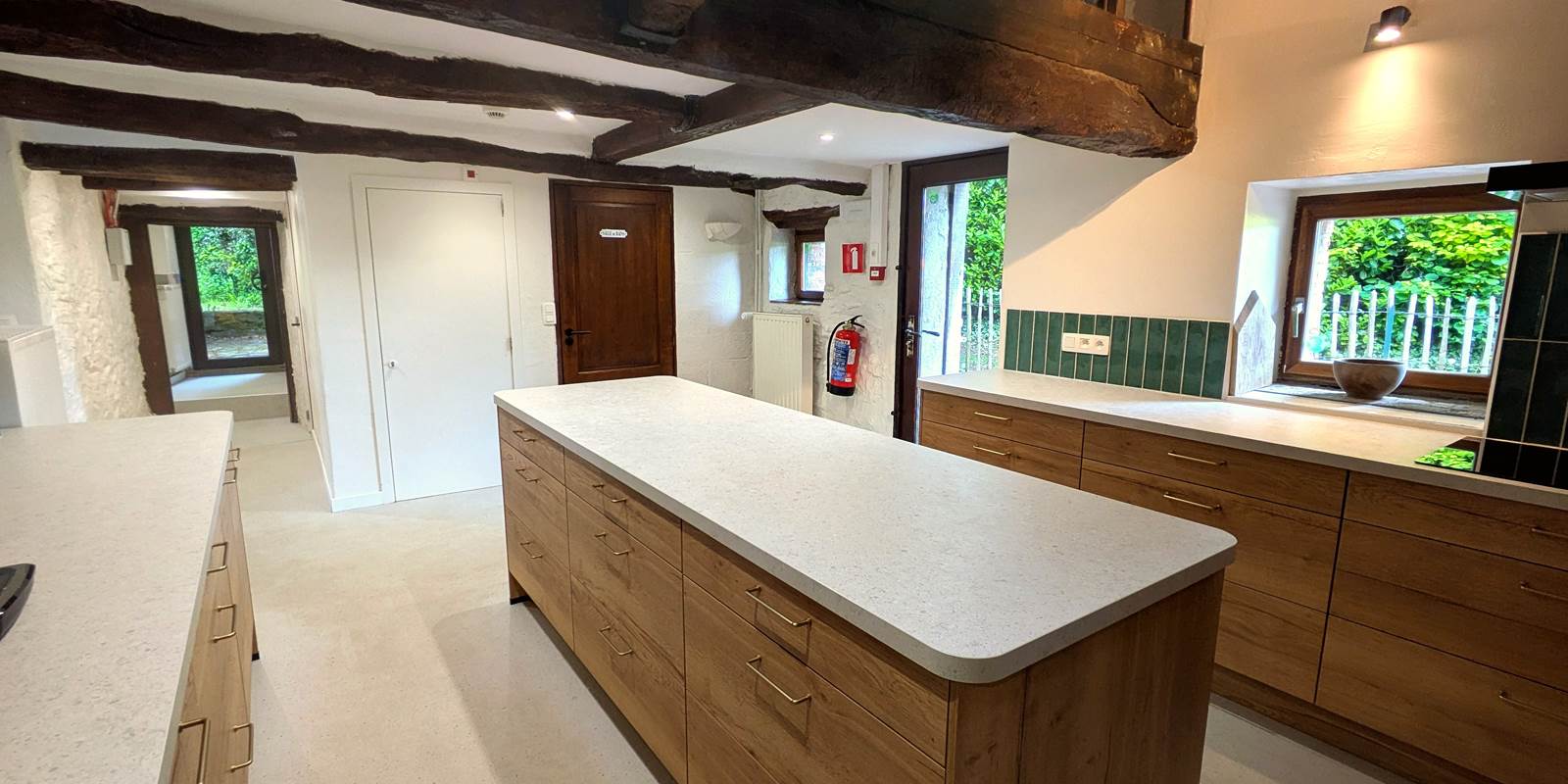 Bright fully equipped kitchen in large group holiday home in Belgium countryside