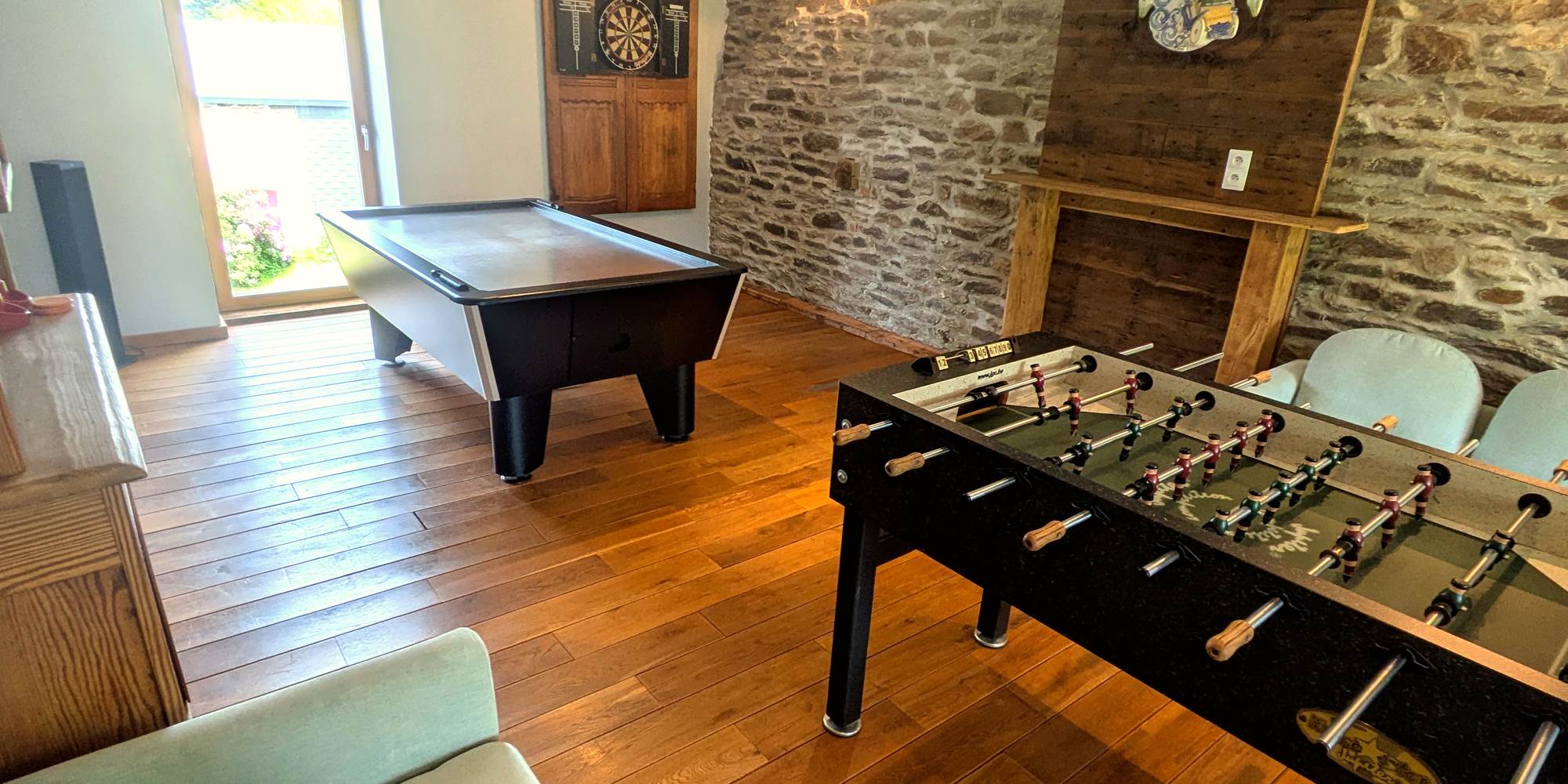 Entertainment room with foosball, air hockey and darts for group stays