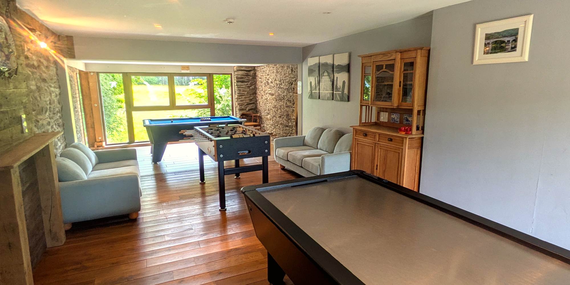 Games room with panoramic view over horse fields and countryside landscape