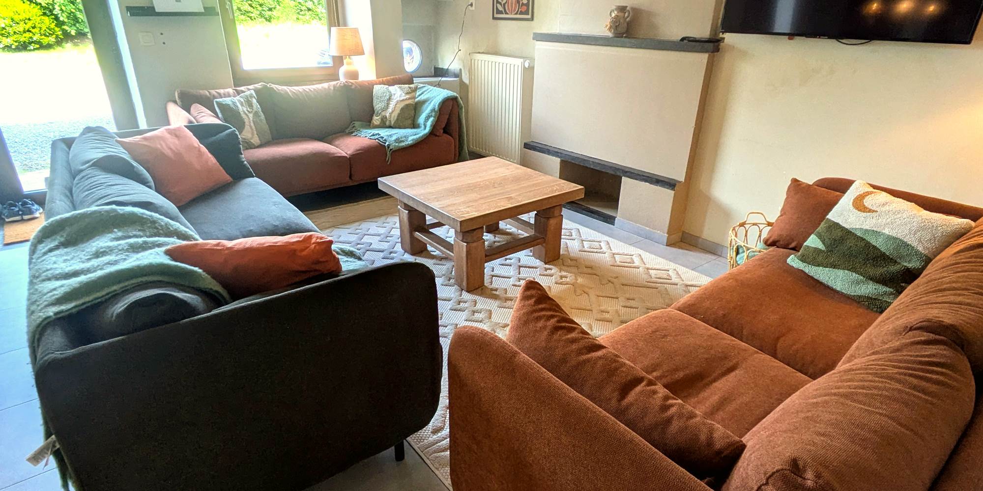 Cozy living room with soft armchairs and warm decorative touches
