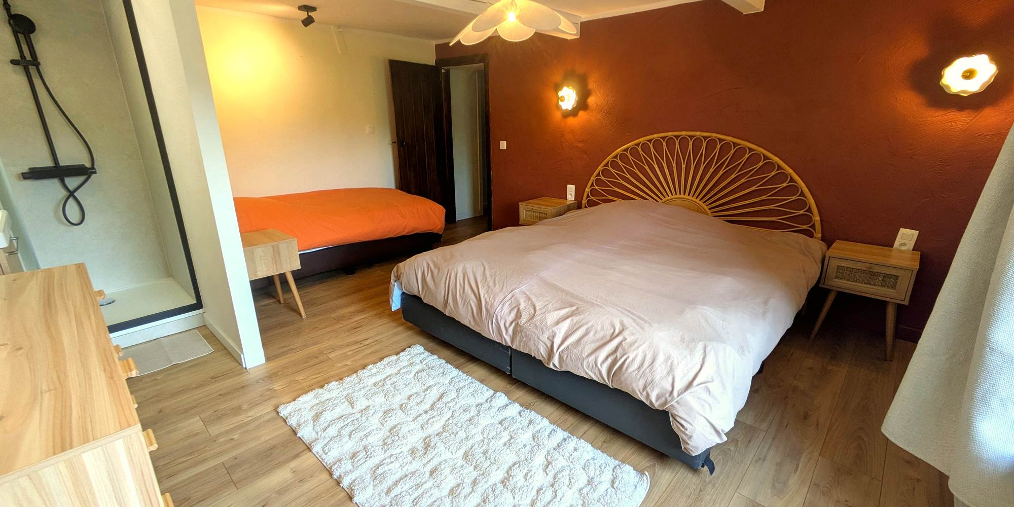 Spacious family bedroom with king bed, single bed and private walk-in shower