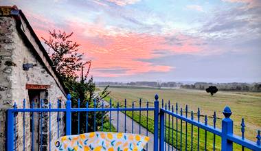 Sunrise view of the historic church and village of Jaulnay, from the balcony at Secret de Campagne, Jaulnay Gites de Famille.