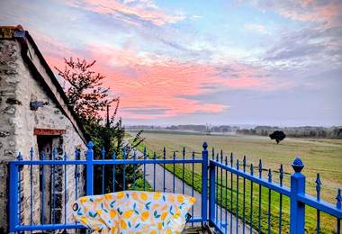 Sunrise view of the historic church and village of Jaulnay, from the balcony at Secret de Campagne, Jaulnay Gites de Famille.