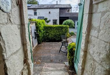 View of the front garden from the original stone entrance to Tuffeau Sunsets, Jaulnay Gites de Famille.