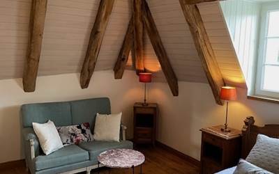 Chambre René - Le coin salon-presta