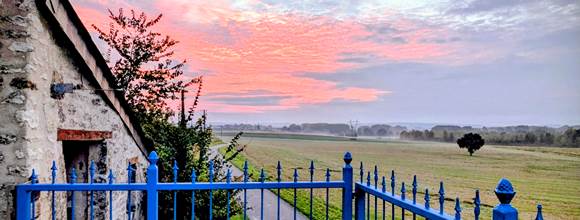 Sunrise view of the historic church and village of Jaulnay, from the balcony at Secret de Campagne, Jaulnay Gites de Famille.