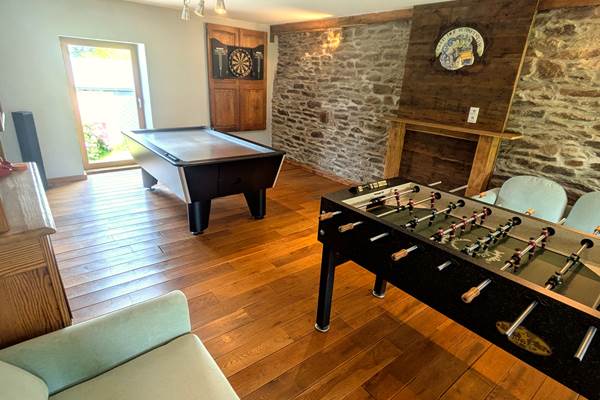 Entertainment room with foosball, air hockey and darts for group stays