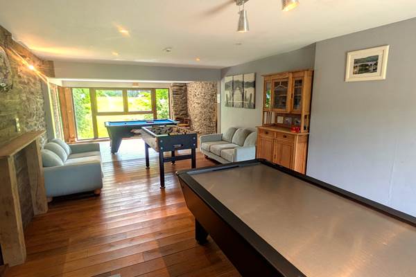 Games room with panoramic view over horse fields and countryside landscape
