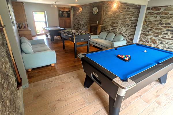 Games room with pool table, foosball, air hockey and darts in family gîte