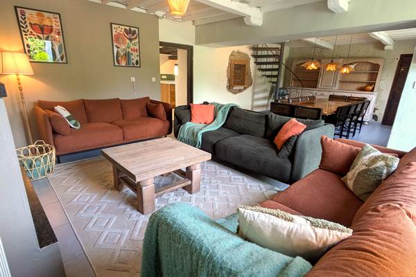 Cozy and elegant living room with soft seating in countryside group holiday home