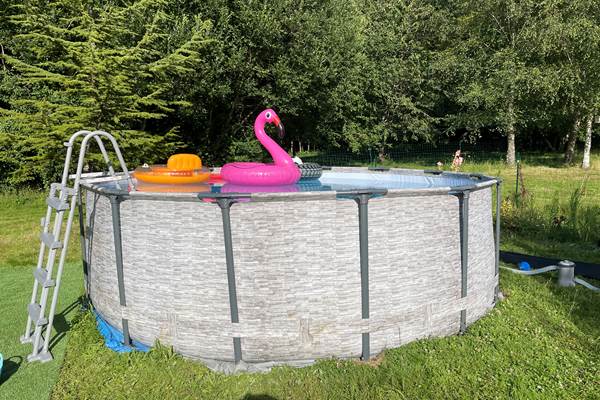 Swimming pool with safety ladder