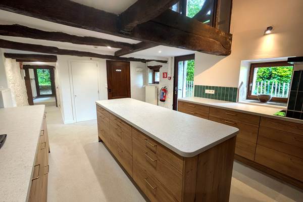 Bright fully equipped kitchen in large group holiday home in Belgium countryside