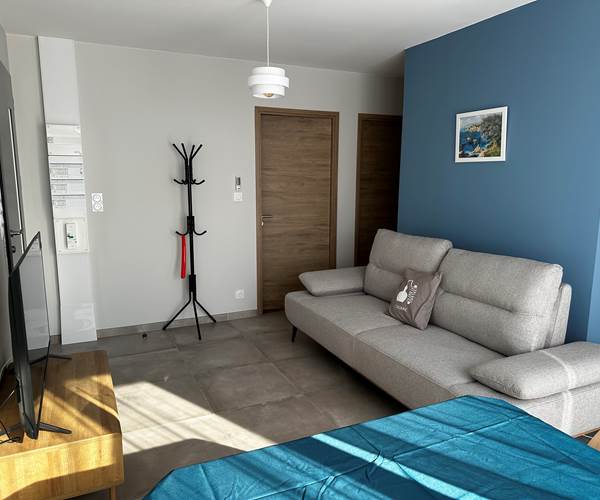 Logement 4 Evasion LE MAINE LOREVA CONSTANT vue salon coin repas