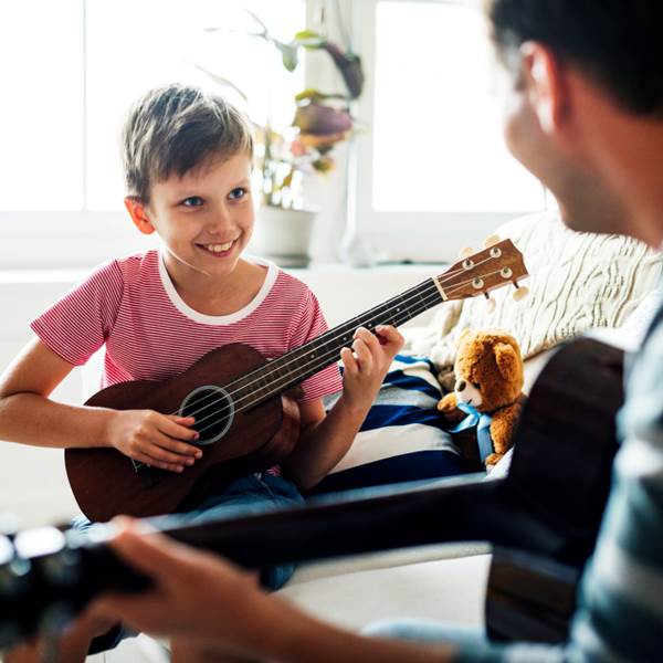 young-boy-playing-guitar (2)-photo-gallery
