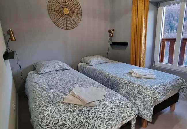 chambre avec 2 lits simples pouvant être rejoints en lit double