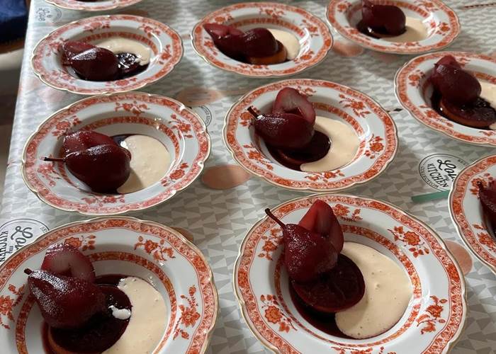 The dessert is pears poached in red Chateau MontPlaisir wine Safres