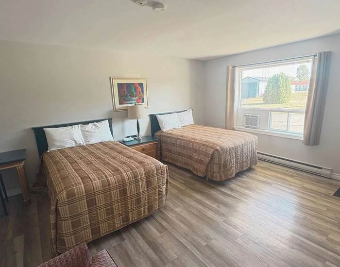 Chambre idéale pour familles avec 2 lits doubles