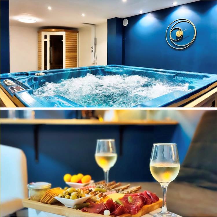 Moment détente avec planche apéritive et verres de vin dans l’espace spa privatif Le Magnolia