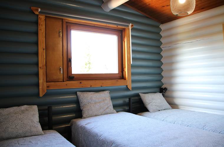 Le chalet du Ménobu "La 2ème chambre à coucher avec trois lits simples"