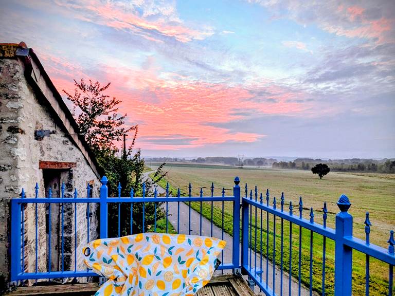 Sunrise view of the historic church and village of Jaulnay, from the balcony at Secret de Campagne, Jaulnay Gites de Famille.