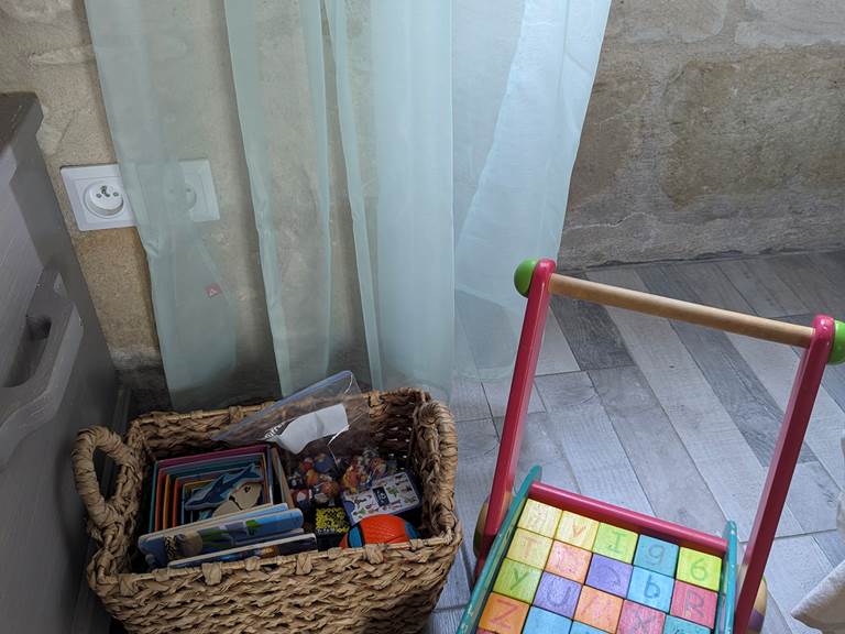 Kids toys in the living room at Tuffeau Sunsets, Jaulnay Gites de Famille for a relaxing start to your family getaway.