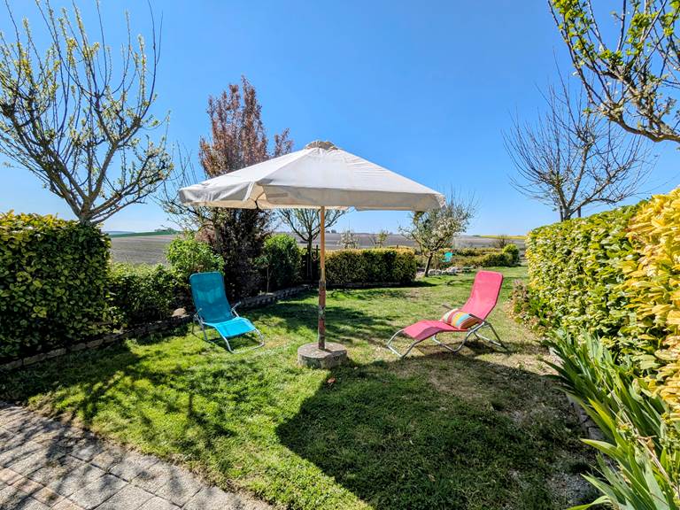 A private back yard at Tuffeau Sunsets, Jaulnay Gites de Famille., for outdoor family moments.