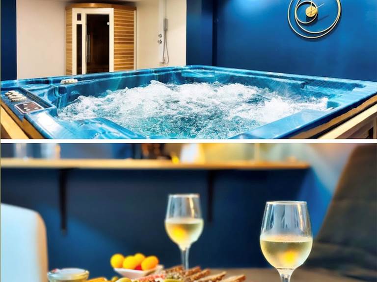 Moment détente avec planche apéritive et verres de vin dans l’espace spa privatif Le Magnolia