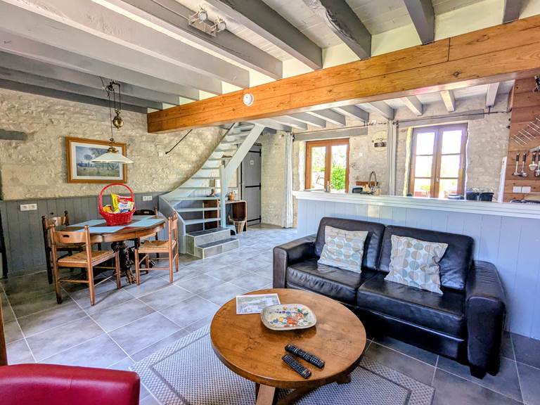 living-room-couch-dining-table-beams-cachette-jaulnay-gites-de-famille