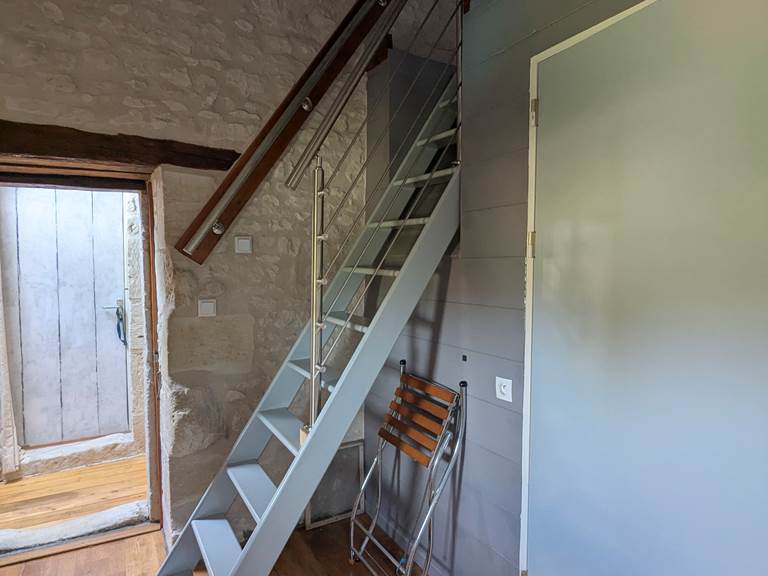 Access to the attic by a steep staircase at Tuffeau Sunsets, Jaulnay Gites de Famille.