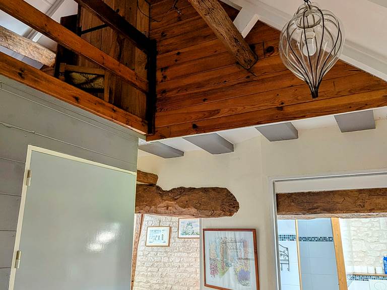 First-floor landing featuring vaulted ceilings and original wood beams at Tuffeau Sunsets, Jaulnay Gites de Famille.