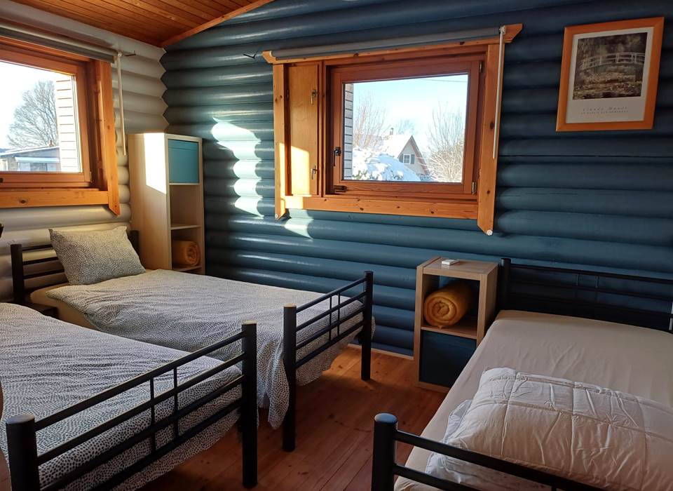 Le chalet du Ménobu 'La 2ème chambre à coucher avec 3 lits simples'