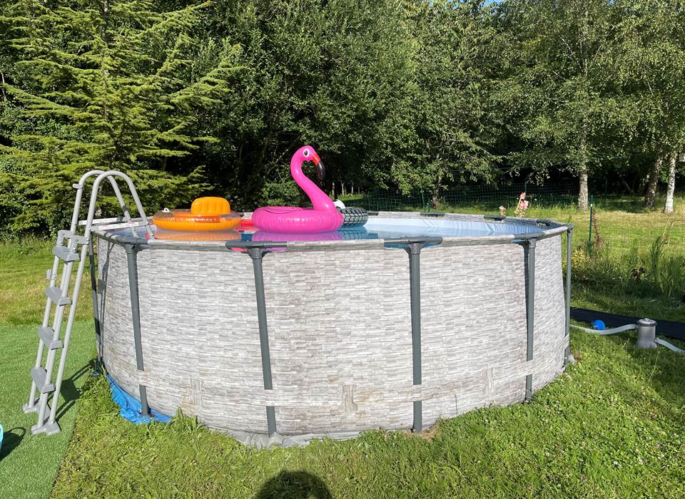 Swimming pool with safety ladder
